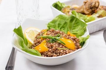 buckwheat with lemon and letuce and fried chicken