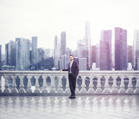 Businessman standing on a terrace