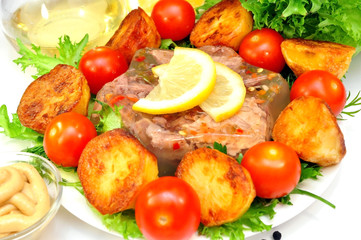 Aspic from meat with roasted potatoes and fresh vegetables