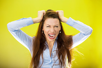 Stressed out, overwhelmed young woman, screaming