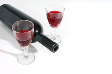Wine glass and wine bottle still life isolated