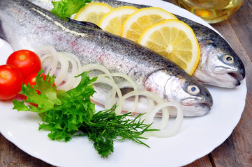 trout on a plate with vegetables