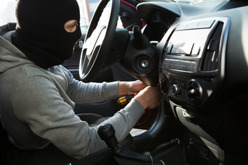 Thief Using Screwdriver In Car