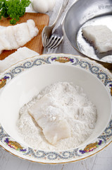 cod filet in flour placed