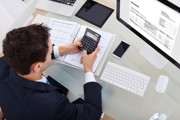 Businessman Calculating Tax