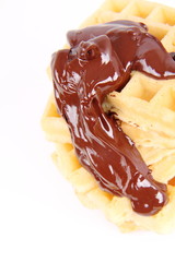 Waffles covered with chocolate on a white background