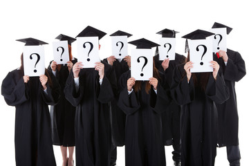 Graduate students showing question signs