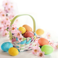 Spring Easter egs and flowers in a basket