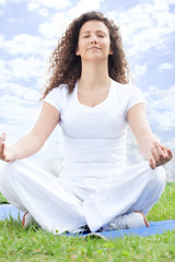 Beautiful young woman doing yoga