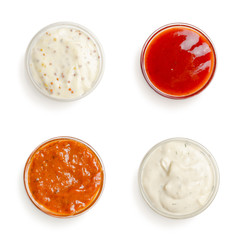 sauces in a gravy boat on white background