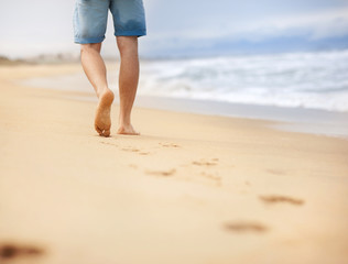 Man wallking at the beach