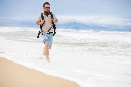 Man Walking On The Beach