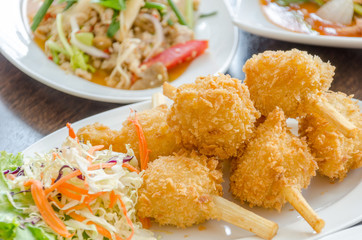 Fried shrimp ball on sugarcane skewers