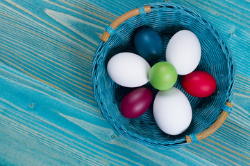 Fototapeta premium Easter basket with color eggs