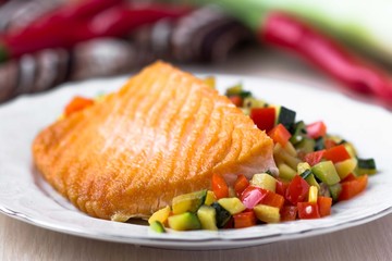 Fried fillet of red fish salmon with roasted vegetables
