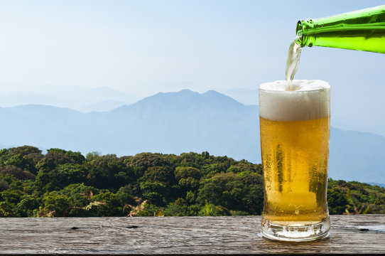 Enjoy beer with mountain landscape.