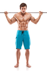 Muscular bodybuilder guy doing exercises with dumbbells over whi