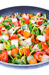 Sliced vegetables in the pan isolated