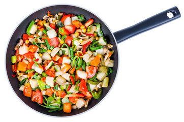 Sliced vegetables in the pan isolated