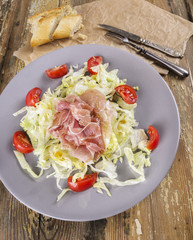 ham, Salad with tomatoes in gray plate