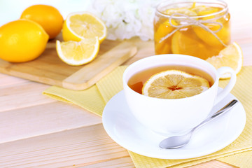 Tasty lemon jam on table close-up