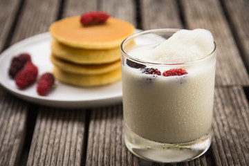 glass of delicious icecream milkshakes and pancake