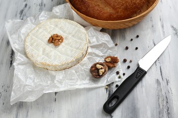 Tasty Italian cheese and bread on wooden table