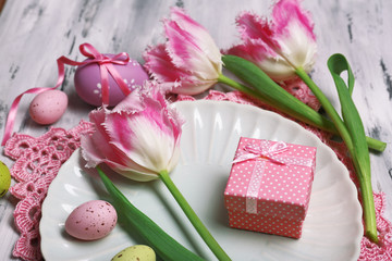 Easter table setting with tulips and eggs