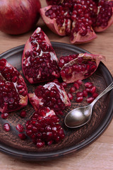 Ripe pomegranates on table close-up
