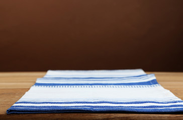 Background with wooden table and tablecloth