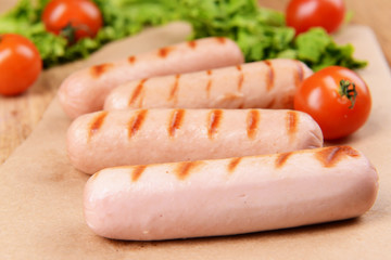 Grilled sausage on table close-up
