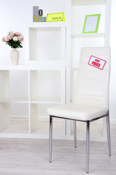 New white furniture with prices on light background