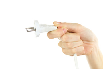 Hand holding electric plug isolated on white