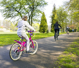 girl riding a bike in park