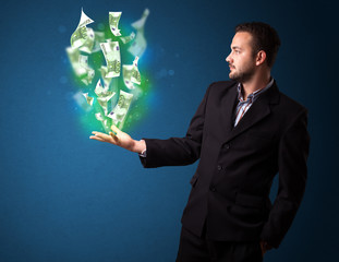 Glowing money in the hand of a businessman