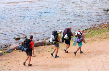 Four tourists with backpacks