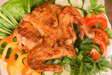 Chicken Tapakats (Tabaka) with vegetables. Georgian cuisine