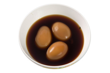 Stewed eggs in cups on white.