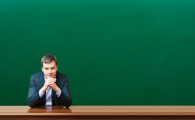 professor against chalkboard background