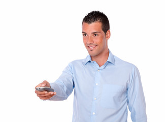 Hispanic man pointing with remote control
