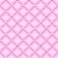 Seamless pink quilted background with silver heart shaped pins.