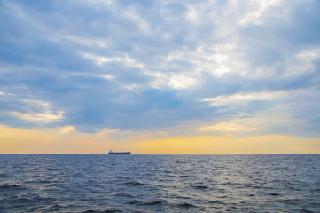 Fototapeta na wymiar Container ship on the horizon