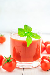 Fresh tomato juice wooden background