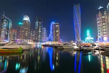 Fototapeta na wymiar Skyscrapers of Dubai Marina at night, United Arab Emirates