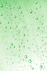 water drops on green glass. macro