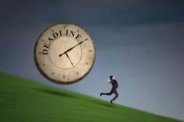 Businesswoman running with a deadline clock