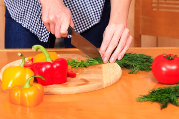 Woman prepares a salad
