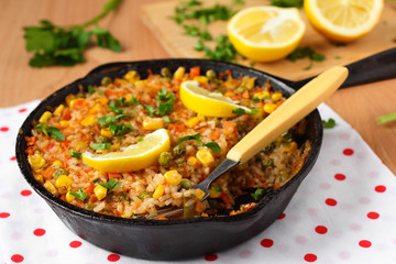 Vegan paella with corn and green peas