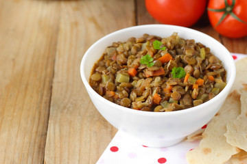 Vegan dinner - green lentils with vegetables