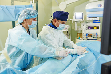 surgeons team at vascular surgery operation